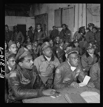 [Photograph of several Tuskegee airmen attending a briefing in Ramitelli, Italy, March 1945] by Toni Frissell LOC